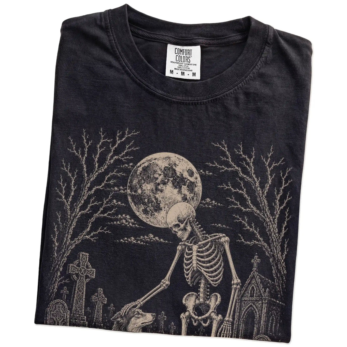 Folded Black Comfort Colors® T-shirt showing Collie sharing a quiet cemetery moment with a friendly skeleton