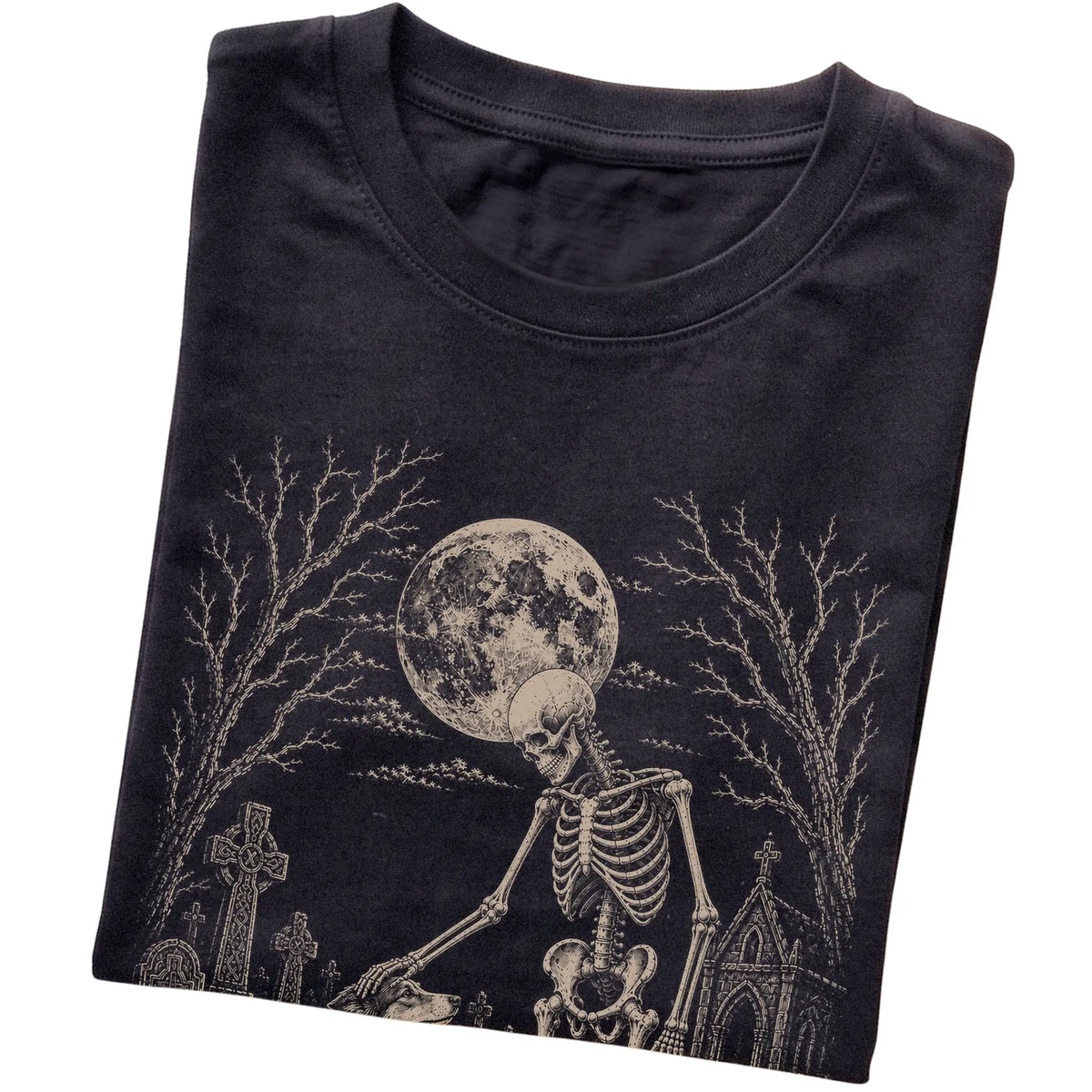 Folded Black T-shirt with a skeleton petting a Collie in a graveyard