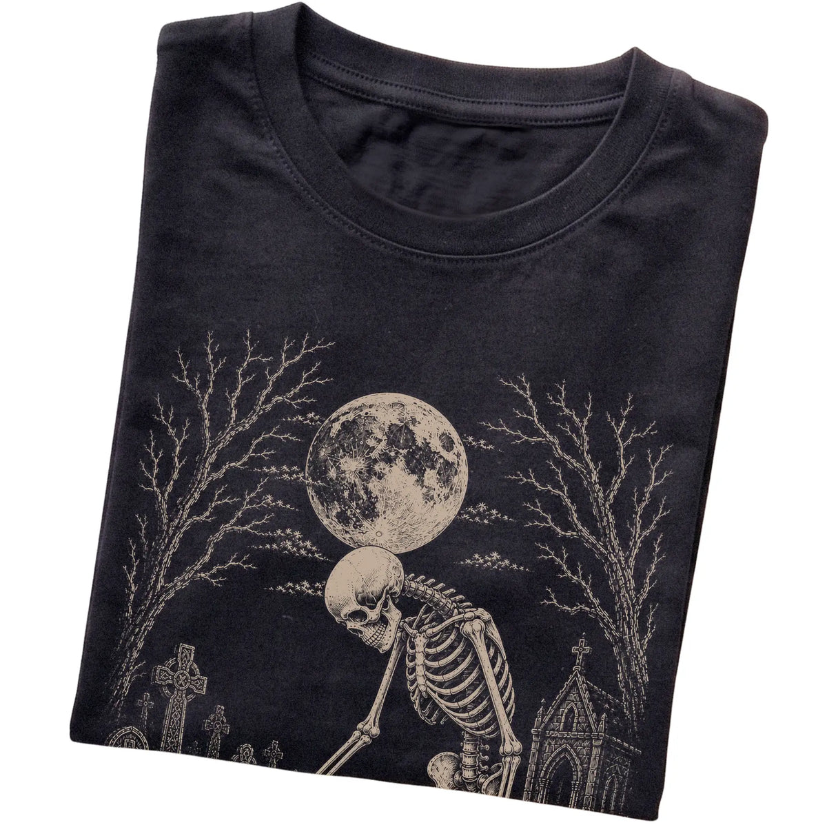 Folded Black T-shirt with a skeleton petting a Corgi in a graveyard