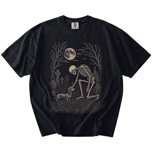 Dachshund sharing a quiet cemetery moment with a friendly skeleton on a Black Comfort Colors® T-shirt