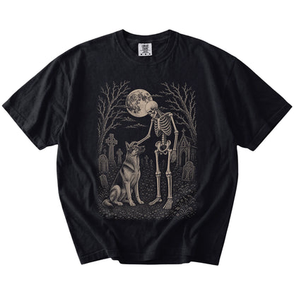 German Shepherd sharing a quiet cemetery moment with a friendly skeleton on a Black Comfort Colors® T-shirt