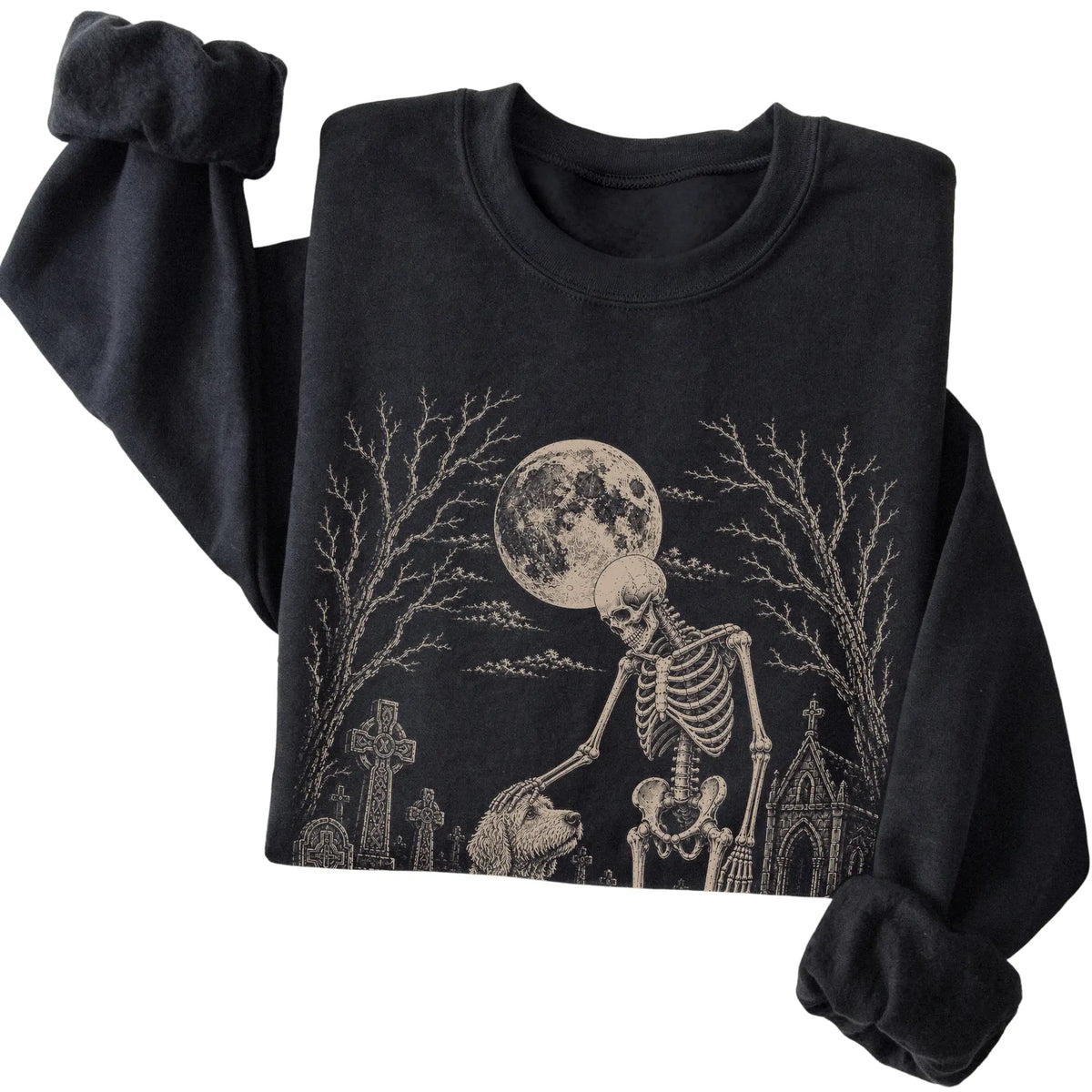 Folded Black sweatshirt with a skeleton petting a Goldendoodle in a graveyard