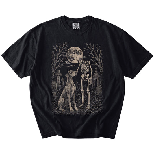 Great Dane sharing a quiet cemetery moment with a friendly skeleton on a Black Comfort Colors® T-shirt