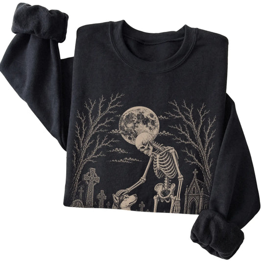 Folded Black sweatshirt with a skeleton petting a Husky in a graveyard