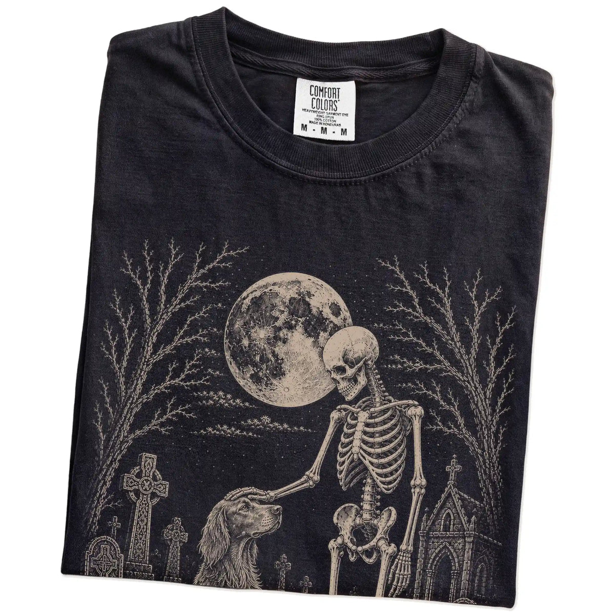 Folded Black Comfort Colors® T-shirt showing Irish Setter sharing a quiet cemetery moment with a friendly skeleton