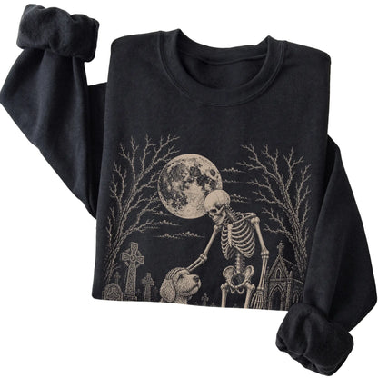 Folded Black sweatshirt with a skeleton petting a Labradoodle in a graveyard