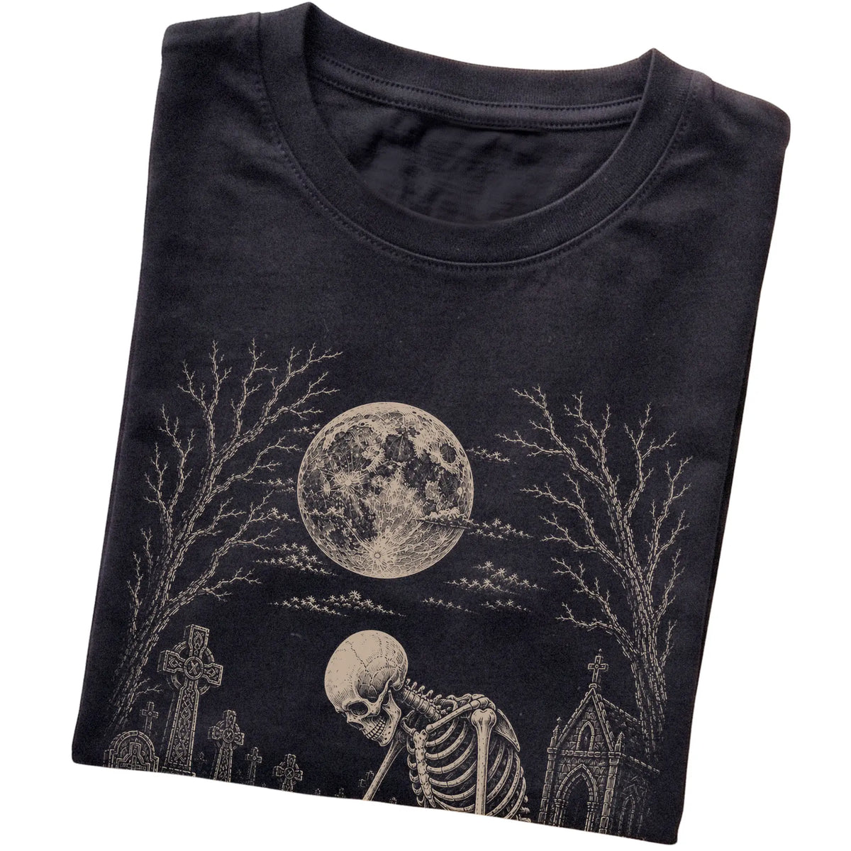 Folded Black T-shirt with a skeleton petting a Maltese in a graveyard