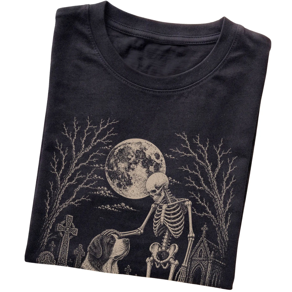 Folded Black T-shirt with a skeleton petting a Saint Bernard in a graveyard
