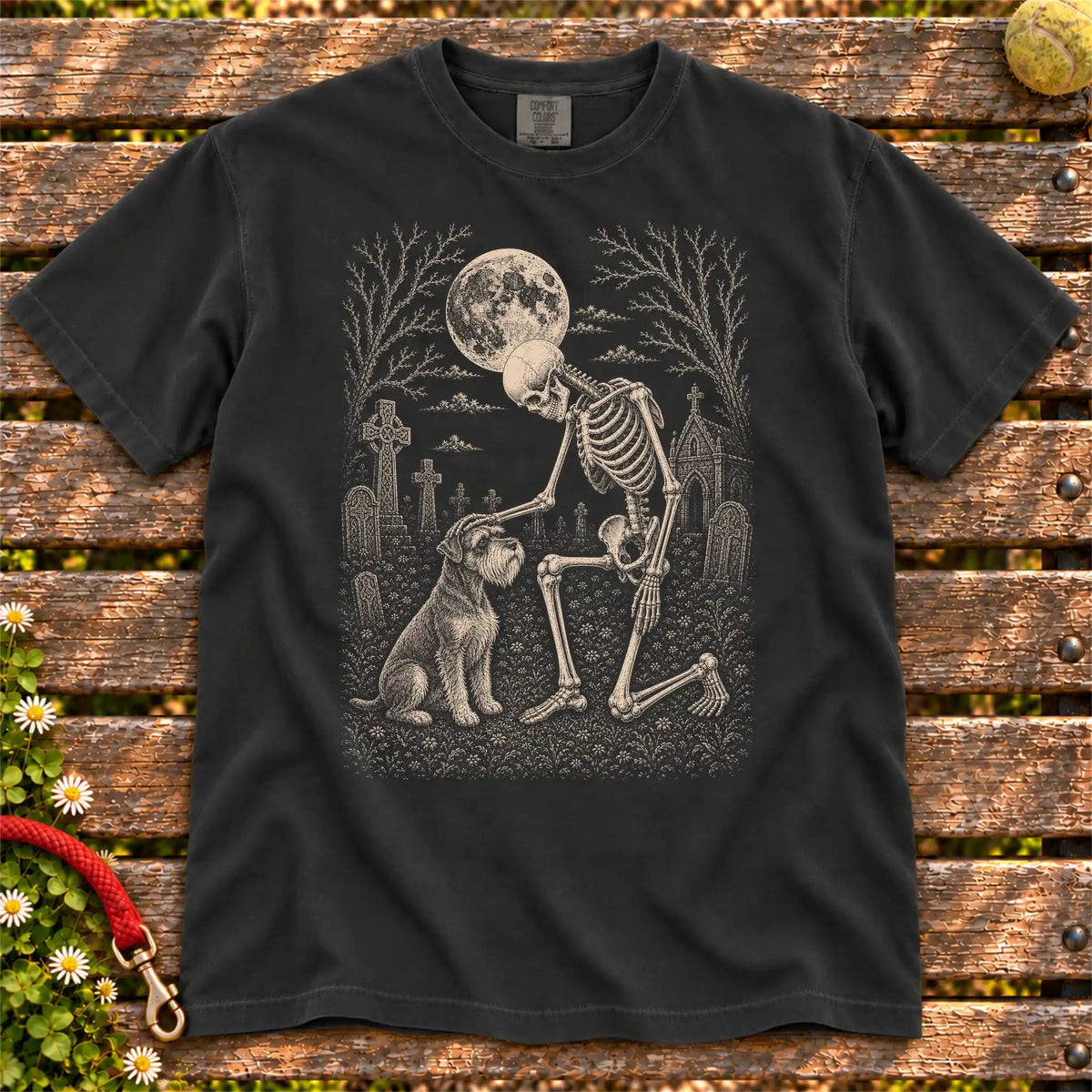Schnauzer sharing a quiet cemetery moment with a friendly skeleton on a Black Comfort Colors® T-shirt