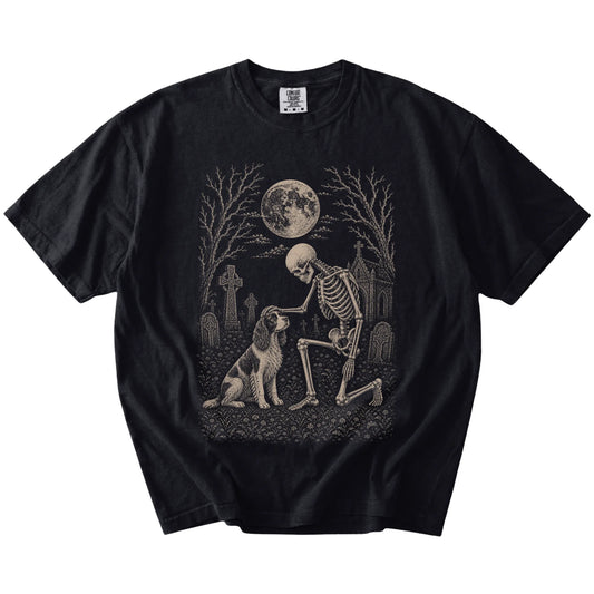 Springer Spaniel sharing a quiet cemetery moment with a friendly skeleton on a Black Comfort Colors® T-shirt