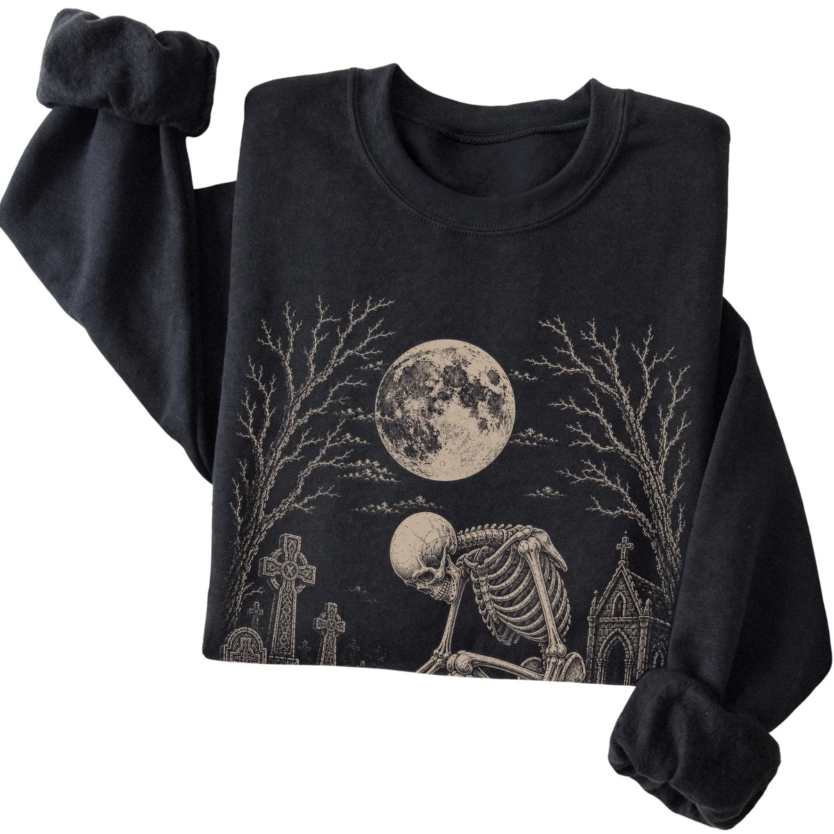 Folded Black sweatshirt with a skeleton petting a Westie in a graveyard