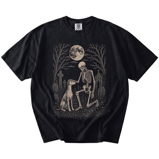 Whippet sharing a quiet cemetery moment with a friendly skeleton on a Black Comfort Colors® T-shirt