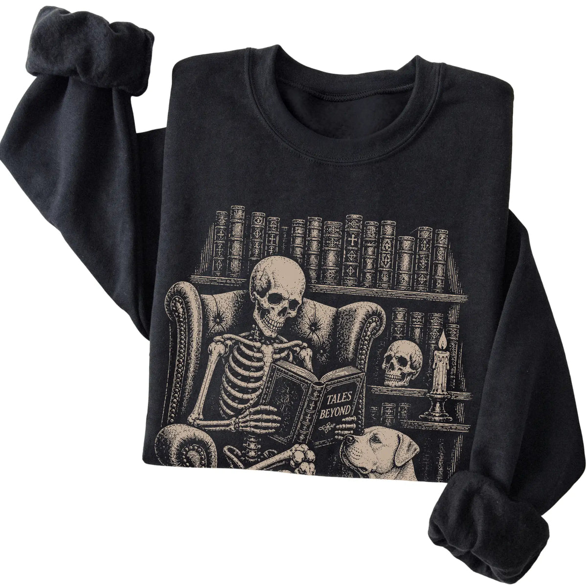 Folded Black sweatshirt with a skeleton reading Tales Beyond to an American Bulldog