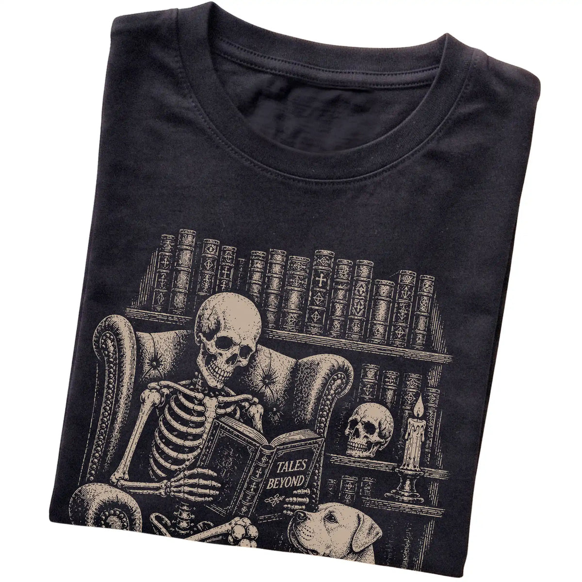 Folded Black T-shirt with a skeleton reading Tales Beyond to an American Bulldog