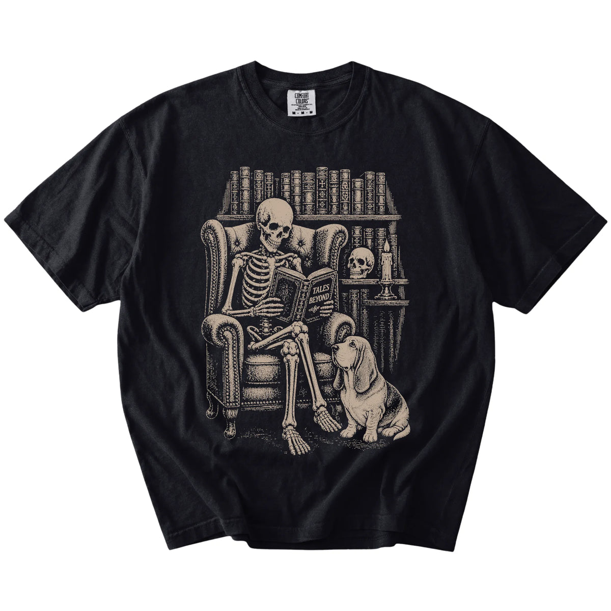 Skeleton reading in a library beside a Basset Hound on a Black Comfort Colors® T-shirt