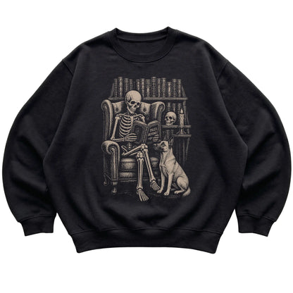 Skeleton reading Tales Beyond to a Belgian Malinois on a Black sweatshirt