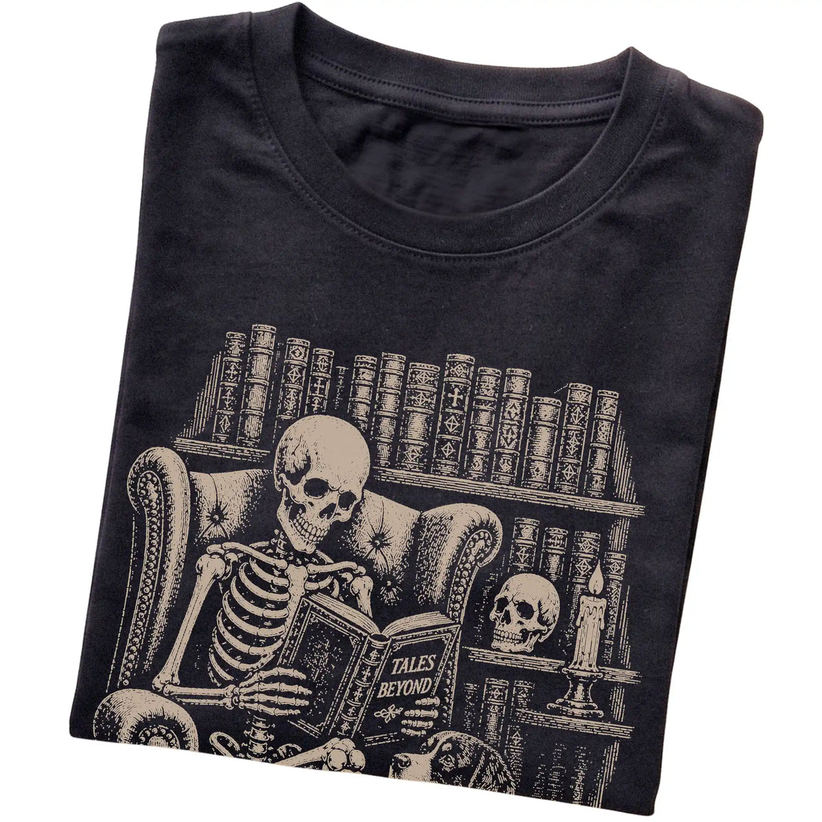 Folded Black T-shirt with a skeleton reading Tales Beyond to a Bernese Mountain Dog