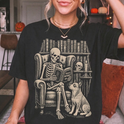Model wearing a Black Comfort Colors® T-shirt showing skeleton reading in a library beside a Blue Heeler