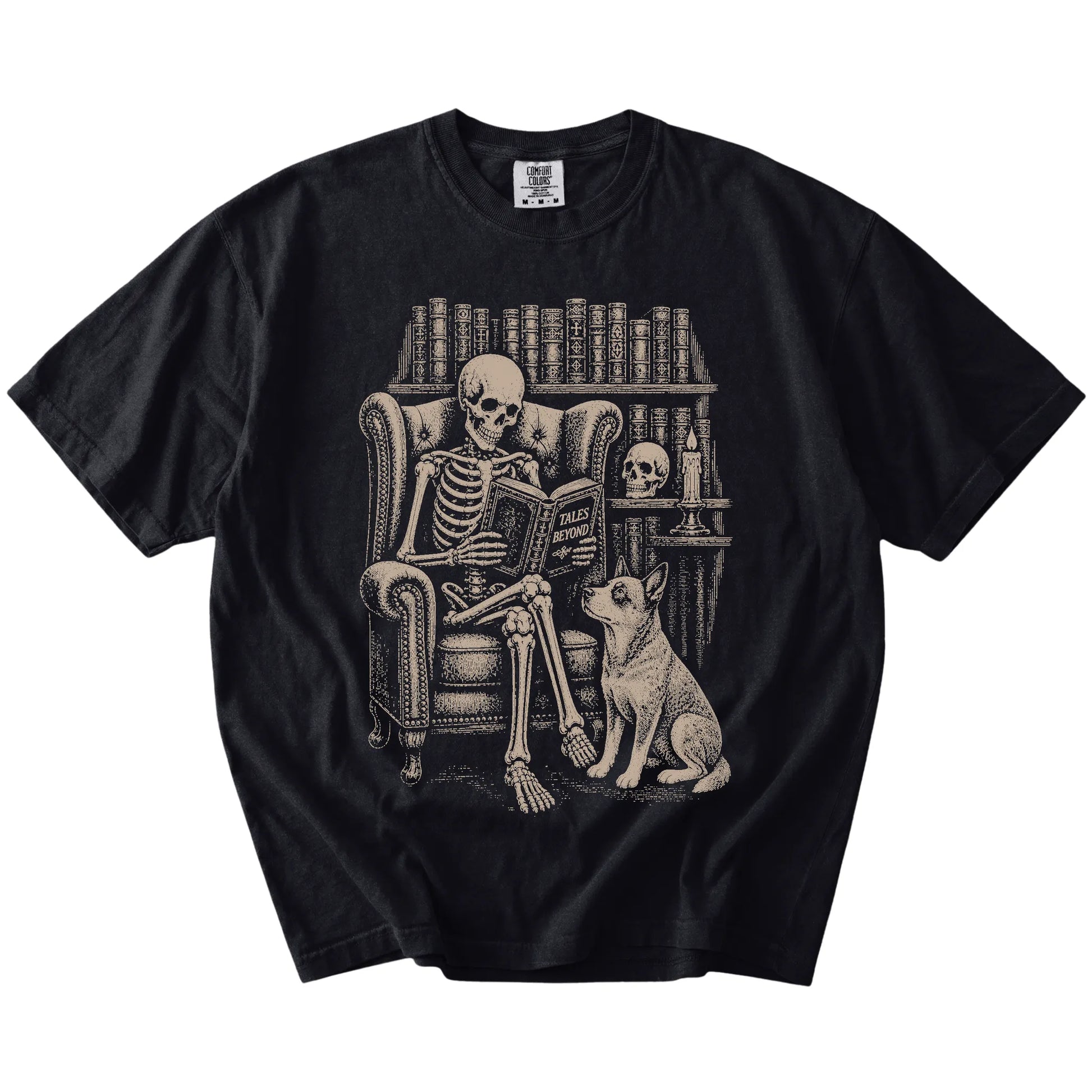 Skeleton reading in a library beside a Blue Heeler on a Black Comfort Colors® T-shirt
