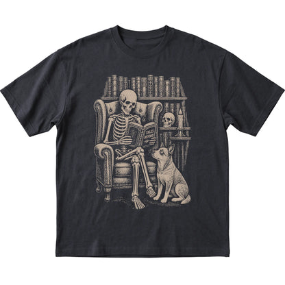 Skeleton reading Tales Beyond to a Blue Heeler on a Black T-shirt