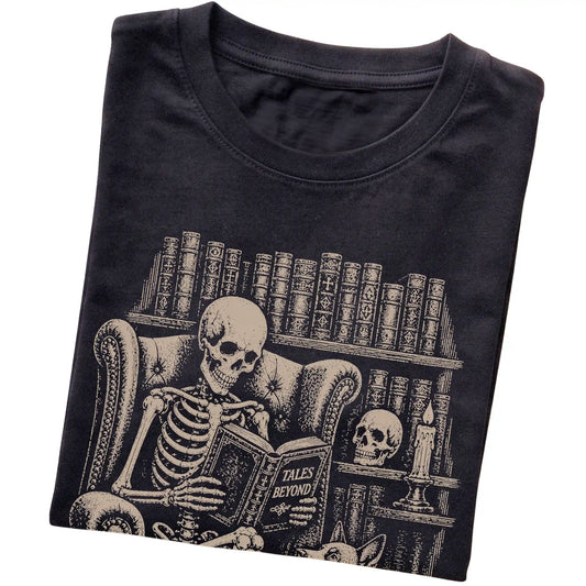 Folded Black T-shirt with a skeleton reading Tales Beyond to a Blue Heeler