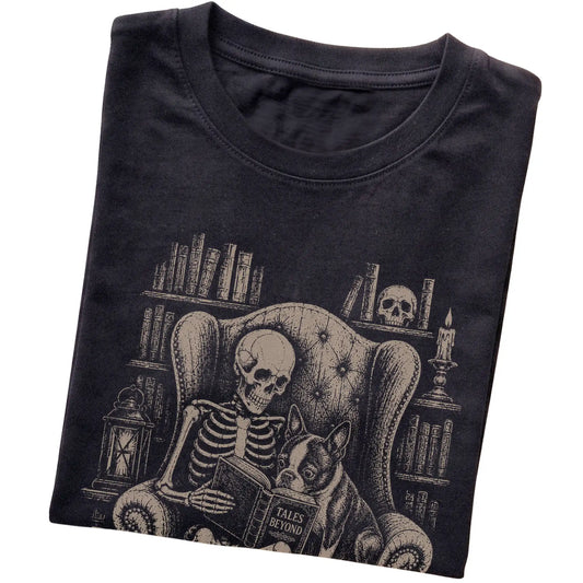 Folded Black T-shirt with a skeleton reading Tales Beyond to a Boston Terrier