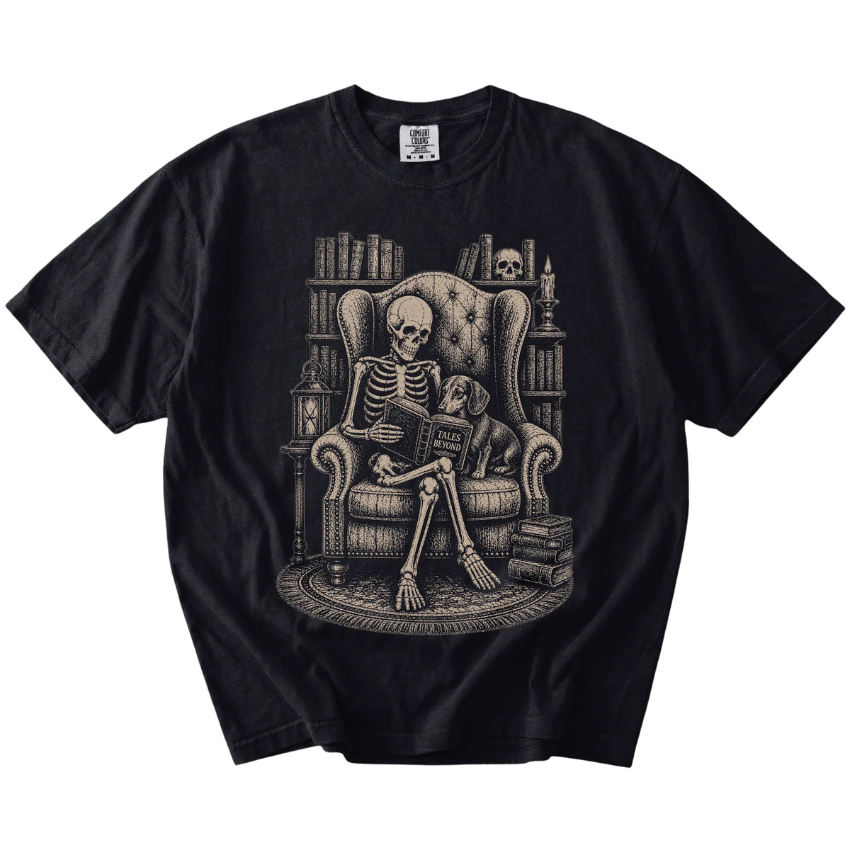 Skeleton reading in a library beside a Dachshund on a Black Comfort Colors® T-shirt