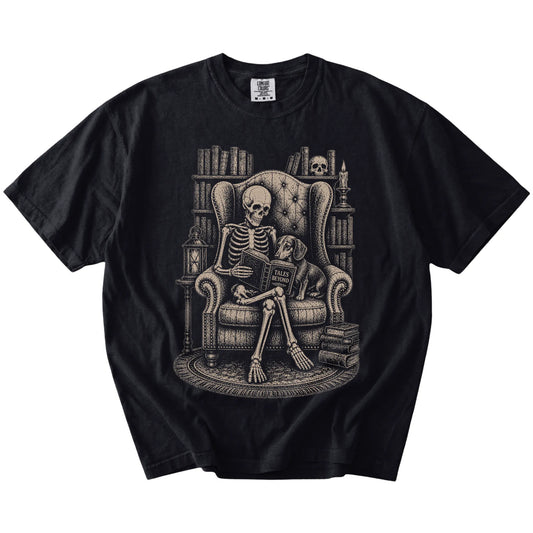 Skeleton reading in a library beside a Dachshund on a Black Comfort Colors® T-shirt