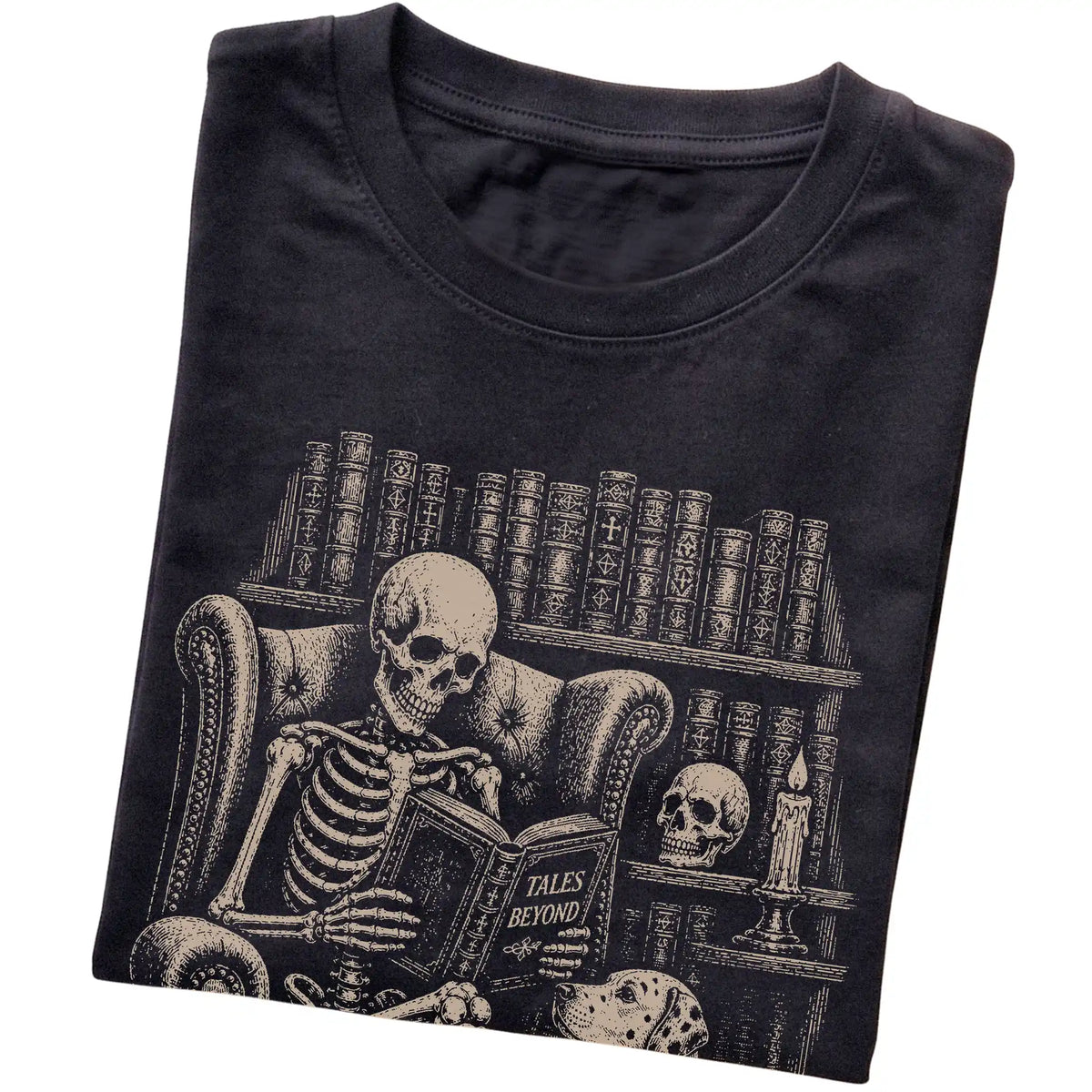 Folded Black T-shirt with a skeleton reading Tales Beyond to a Dalmatian