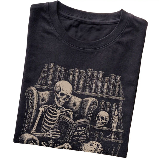 Folded Black T-shirt with a skeleton reading Tales Beyond to a Dalmatian