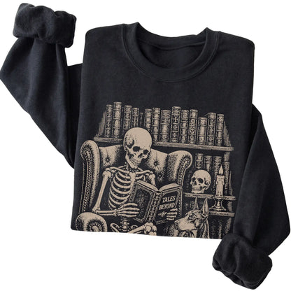 Folded Black sweatshirt with a skeleton reading Tales Beyond to a Doberman
