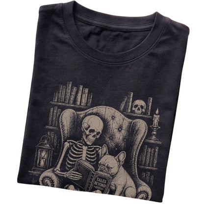 Folded Black T-shirt with a skeleton reading Tales Beyond to a French Bulldog