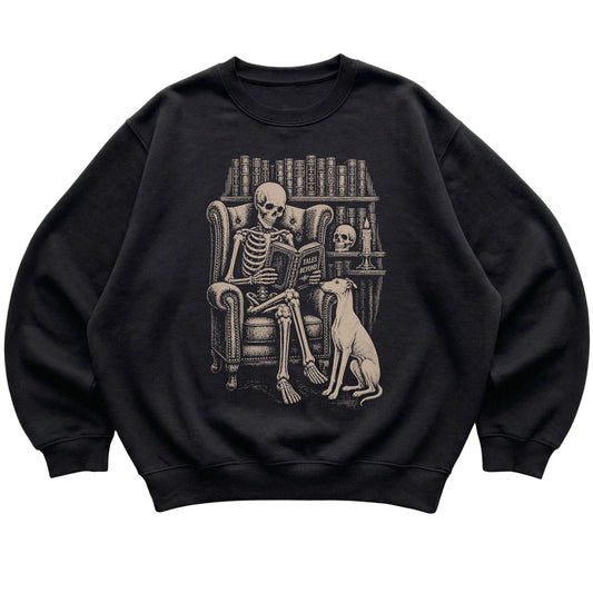 Skeleton reading Tales Beyond to a Greyhound on a Black sweatshirt