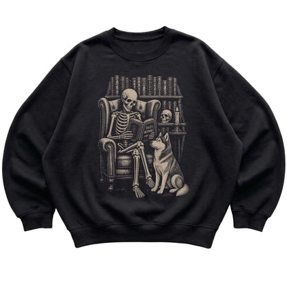 Skeleton reading Tales Beyond to a Husky on a Black sweatshirt