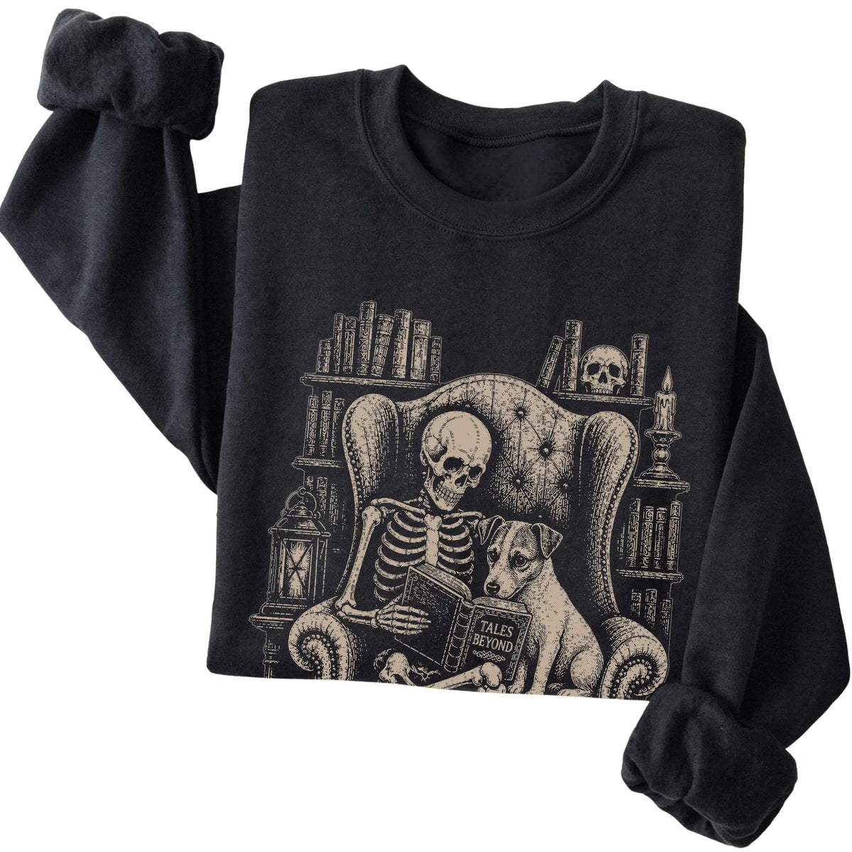 Folded Black sweatshirt with a skeleton reading Tales Beyond to a Jack Russell