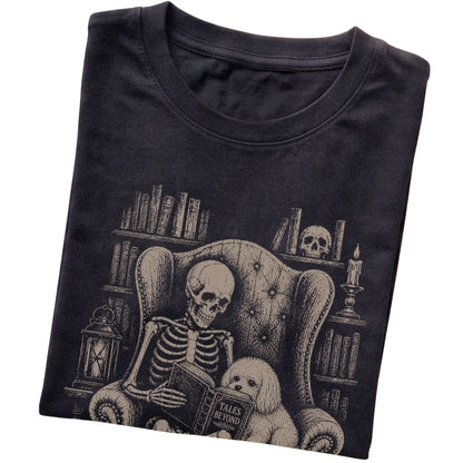 Folded Black T-shirt with a skeleton reading Tales Beyond to a Maltese