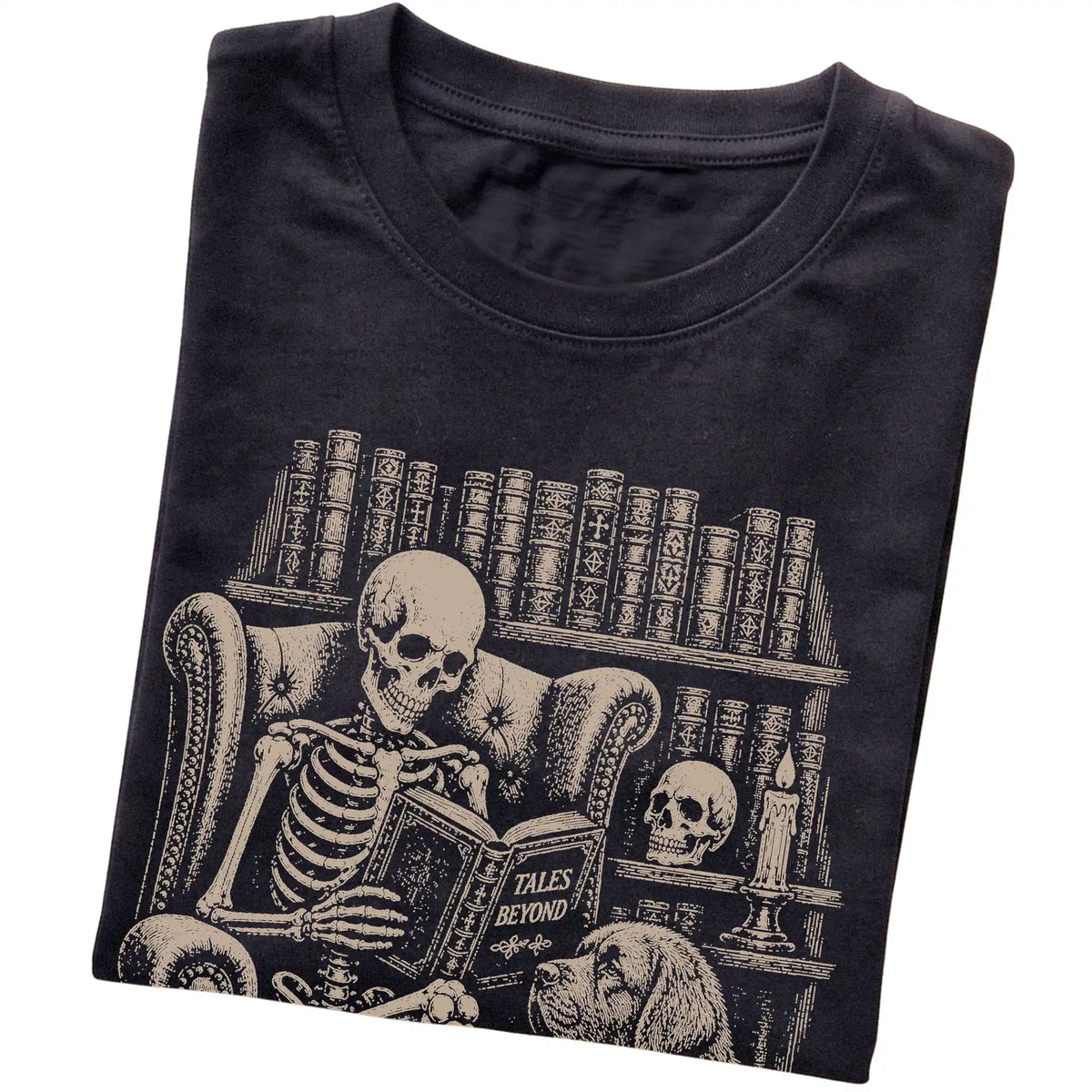 Folded Black T-shirt with a skeleton reading Tales Beyond to a Newfie