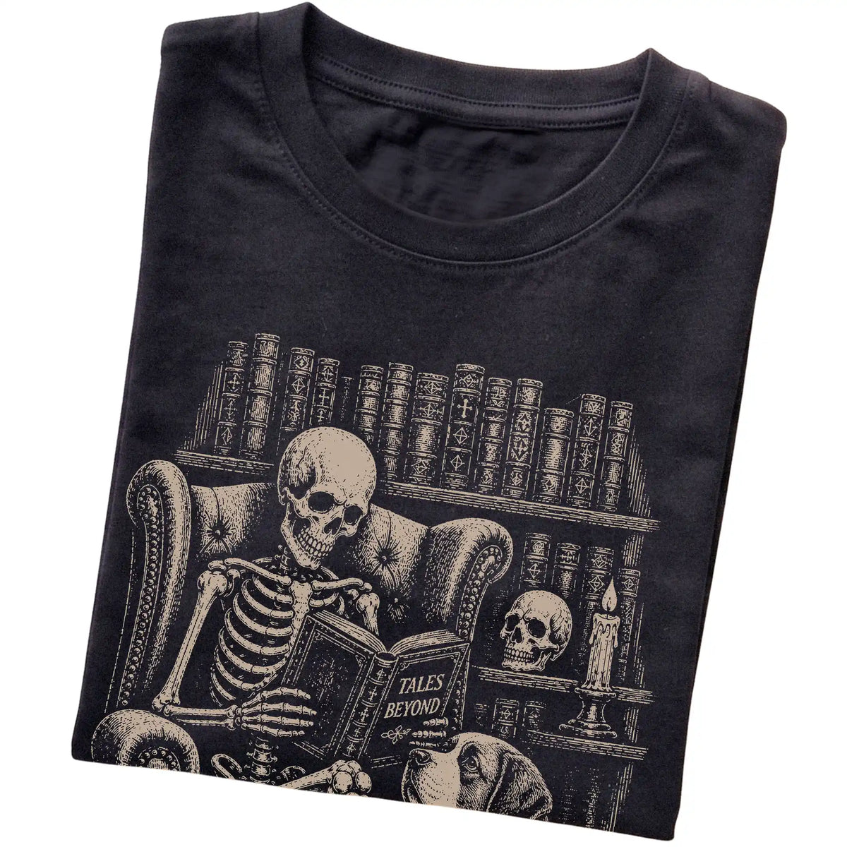 Folded Black T-shirt with a skeleton reading Tales Beyond to a Saint Bernard
