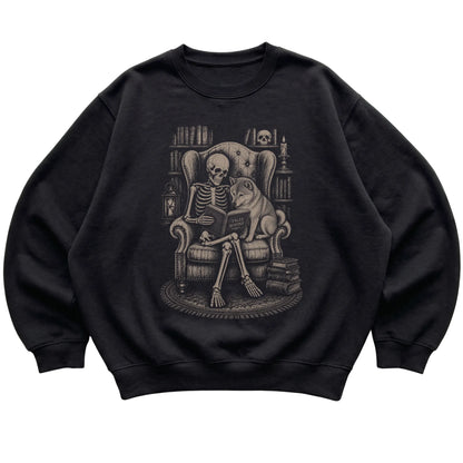 Skeleton reading Tales Beyond to a Shiba Inu on a Black sweatshirt