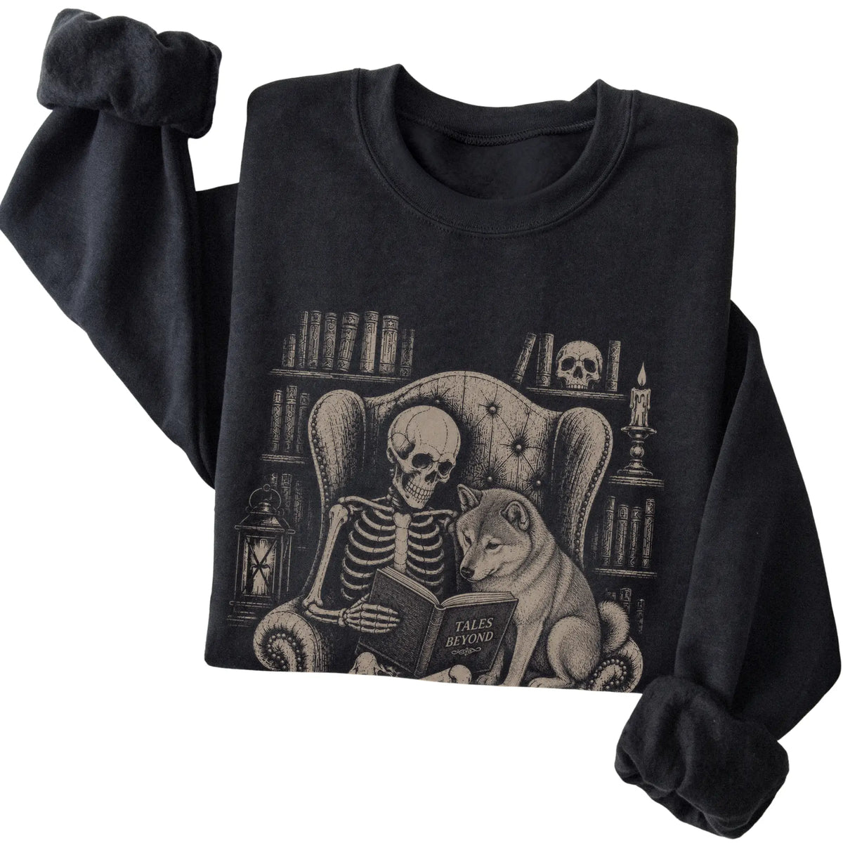 Folded Black sweatshirt with a skeleton reading Tales Beyond to a Shiba Inu