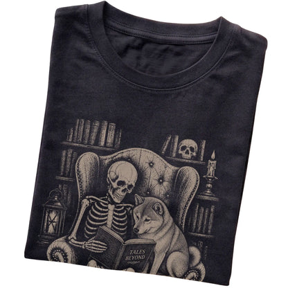 Folded Black T-shirt with a skeleton reading Tales Beyond to a Shiba Inu