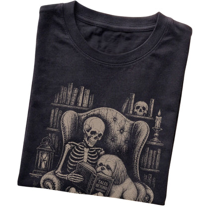 Folded Black T-shirt with a skeleton reading Tales Beyond to a Shih Tzu