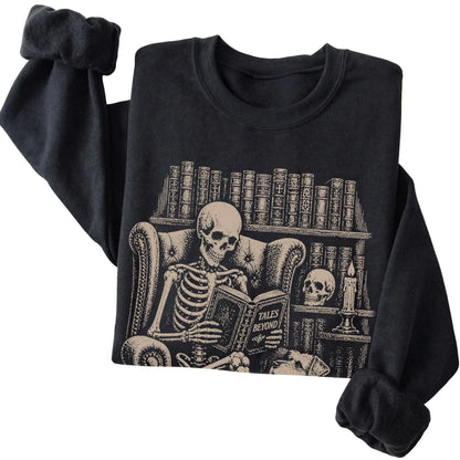 Folded Black sweatshirt with a skeleton reading Tales Beyond to a Schnauzer