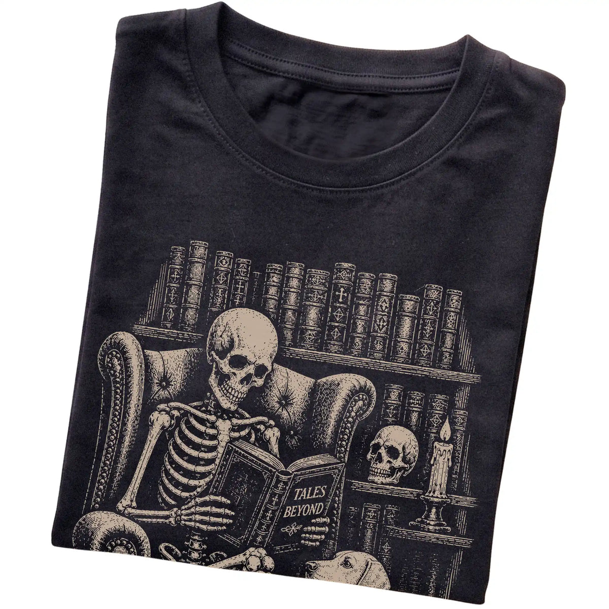 Folded Black T-shirt with a skeleton reading Tales Beyond to a Vizsla