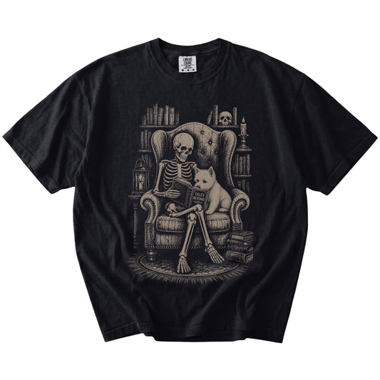 Skeleton reading in a library beside a Westie on a Black Comfort Colors® T-shirt