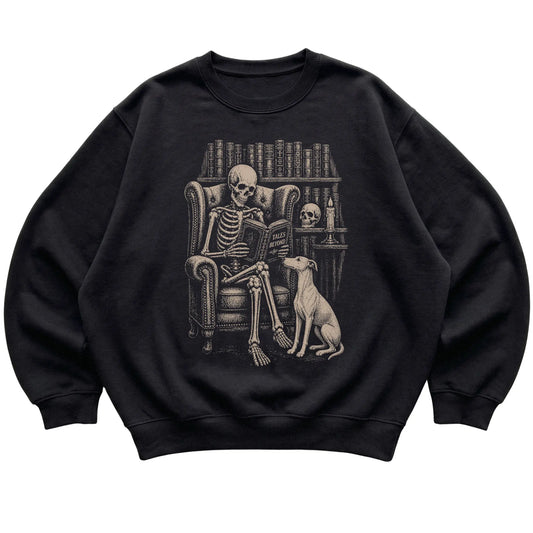 Skeleton reading Tales Beyond to a Whippet on a Black sweatshirt