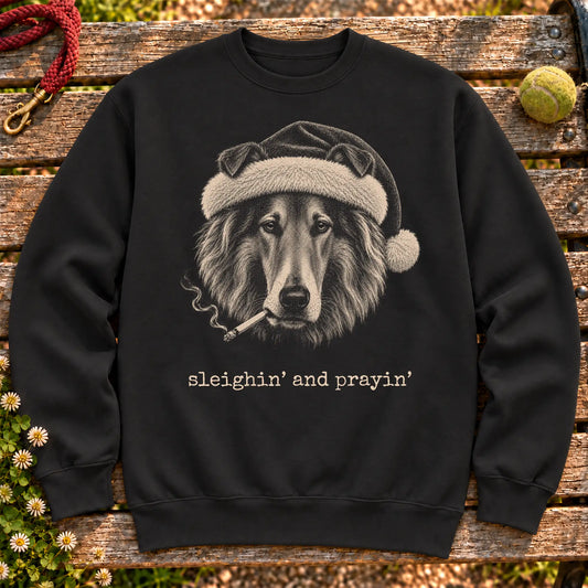 Collie wearing a Santa hat and smoking on a Black sweatshirt