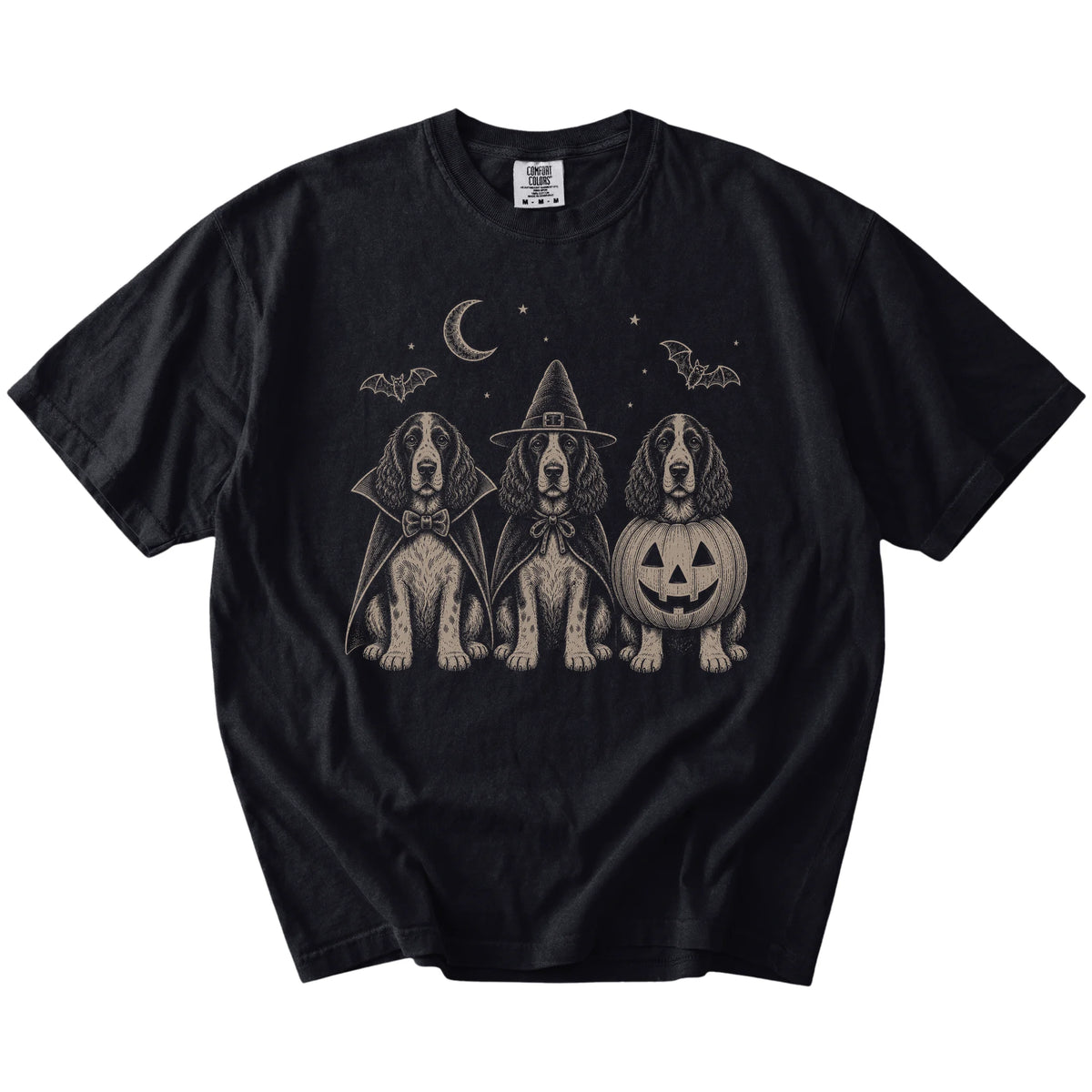 Three Springer Spaniel dogs dressed for Halloween beneath bats and a crescent moon on a Black Comfort Colors® T-shirt