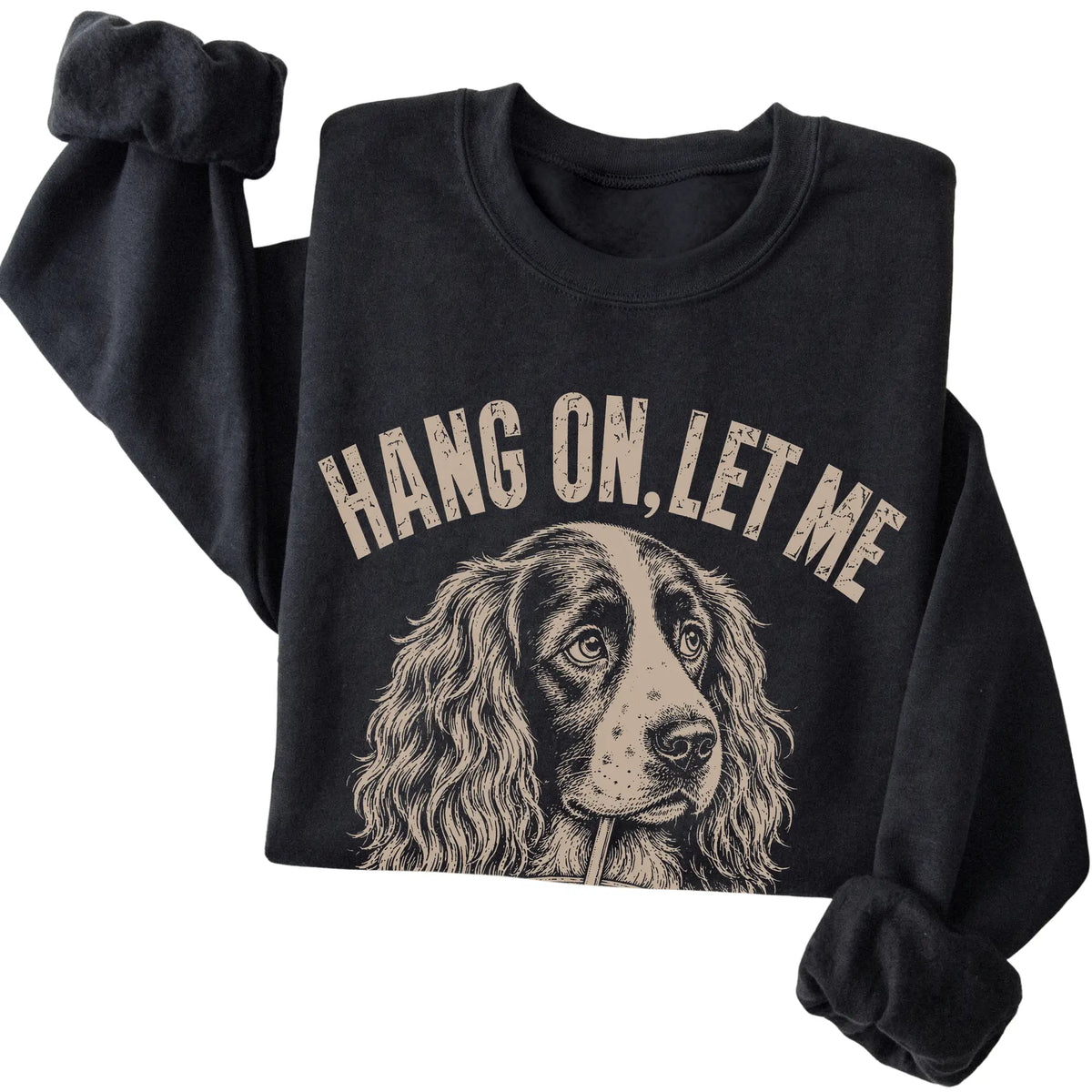 Black crewneck sweatshirt featuring Overthinking Springer Spaniel, folded presentation