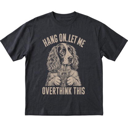 Black T-shirt featuring Overthinking Springer Spaniel, laid-flat presentation